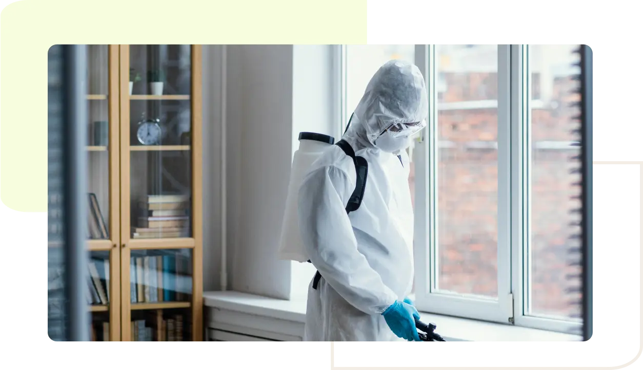 Technician in protective suit inspecting home